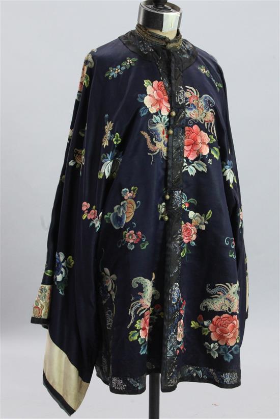 A Chinese midnight blue silk robe, late 19th century, length 92cm